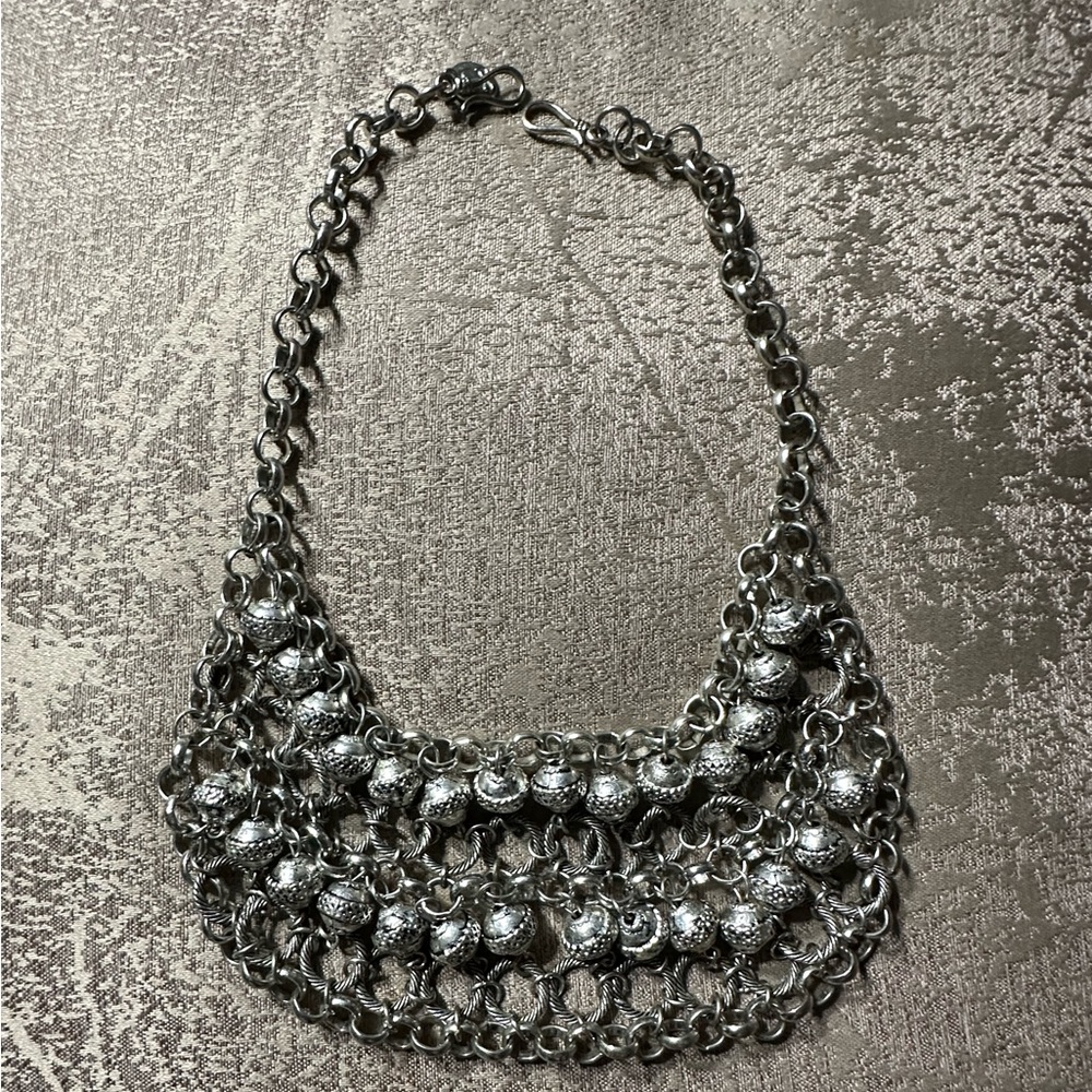 Silver tone necklace.